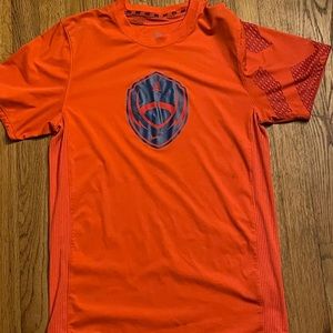 Orange Nike dri-fit shirt with a blue football